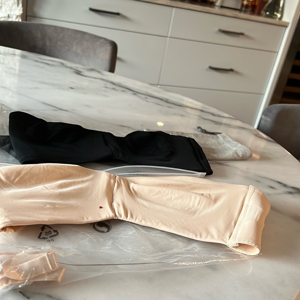 New bra nude and black 36c can be worn with or without straps .